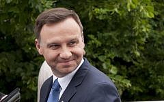 Andrzej Duda, presidential candidate of the Polish conservative party PiS (Law and Justice) leaves after voting during the second round of the presidential election at a polling station in Krakow, Poland on May 24, 2015. (AFP PHOTO / BARTOSZ SIEDLIK)