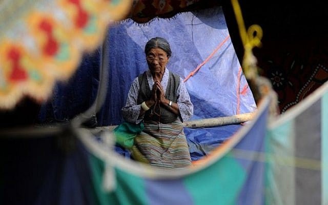 A Nepalese resident prays at a temple in Kathmandu on May 25, 2015 as the country marks one month since a deadly earthquake struck the country, killing more than 8,600 people. (AFP/ISHARA S. KODIKARA) A Nepalese resident prays at a temple in Kathmandu on May 25, 2015 as the country marks one month since a deadly earthquake struck the country, killing more than 8,600 people. (AFP/ISHARA S. KODIKARA)