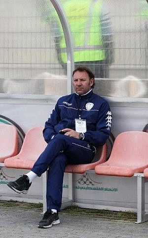 Ahli al-Khalil football club's coach, Italian Stefano Cusin looks at his players during a training session on April 24, 2015 in the West Bank town of Hebron. (photo credit: AFP PHOTO / HAZEM BADER)