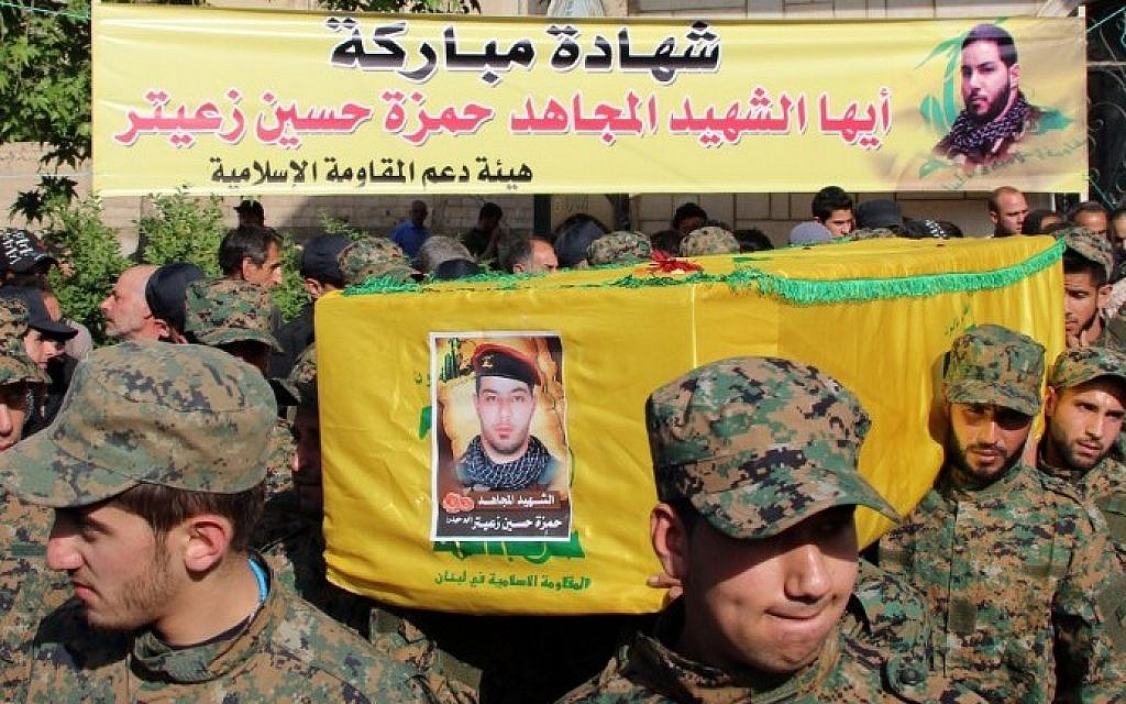 Hezbollah fighters carry the coffin of fellow Shiite fighter Hamza Hussein Zeiter during his funeral on May 5, 2015 in the town of Baalbek in eastern Lebanon's Bekaa Valley. The Hezbollah fighter was killed during clashes with members of Al-Nusra Front in the Syrian region of Qalamoun. (AFP) Hezbollah fighters carry the coffin of fellow Shiite fighter Hamza Hussein Zeiter during his funeral on May 5, 2015 in the town of Baalbek in eastern Lebanon's Bekaa Valley. The Hezbollah fighter was killed during clashes with members of Al-Nusra Front in the Syrian region of Qalamoun. (AFP)