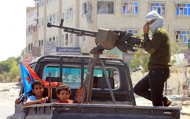 File photo: Yemeni children holding rifles sit in the back of a heavily armed pick up truck with fighters loyal to Yemen's Saudi-backed President Abd Rabbo Mansour Hadi in the Dar Saad neighborhood of the southern Yemeni city of Aden on May 10, 2015, as they continue to battle Shiite Houthi rebels. (AFP/Saleh Al-Obeidi) File photo: Yemeni children holding rifles sit in the back of a heavily armed pick up truck with fighters loyal to Yemen's Saudi-backed President Abd Rabbo Mansour Hadi in the Dar Saad neighborhood of the southern Yemeni city of Aden on May 10, 2015, as they continue to battle Shiite Houthi rebels. (AFP/Saleh Al-Obeidi)