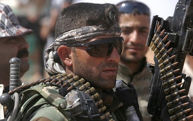 An Iraqi paramilitary fighter holds a weapon in the area surrounding the village of Nukhayb in the embattled Anbar province, west of the Iraqi capital of Baghdad, on May 19, 2015. (AFP/Mohammed Sawaf) An Iraqi paramilitary fighter holds a weapon in the area surrounding the village of Nukhayb in the embattled Anbar province, west of the Iraqi capital of Baghdad, on May 19, 2015. (AFP/Mohammed Sawaf)