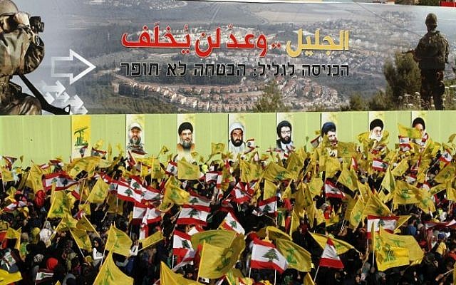 Lebanese supporters of Hezbollah in the southern town of Nabatiyeh on May 24, 2015, watch a televised address by Hassan Nasrallah, the movement's leader. A sign reads in Arabic and Hebrew: "Invasion of the Galilee - the promise will not be broken." (Mahmoud Zayat/AFP) Lebanese supporters of Hezbollah in the southern town of Nabatiyeh on May 24, 2015, watch a televised address by Hassan Nasrallah, the movement's leader. A sign reads in Arabic and Hebrew: "Invasion of the Galilee - the promise will not be broken." (Mahmoud Zayat/AFP)