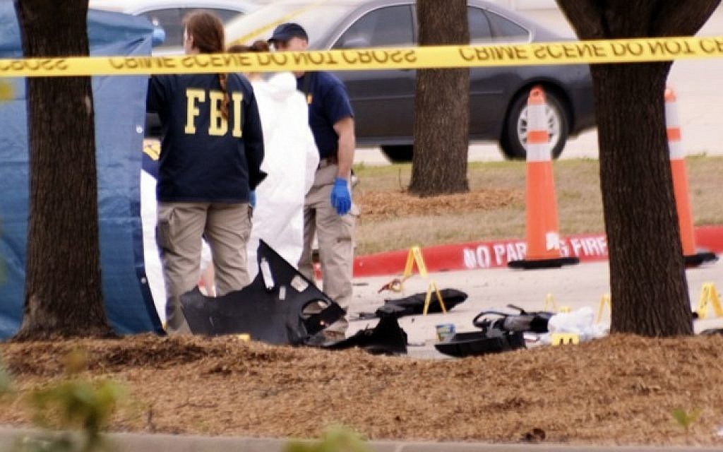 An FBI agent views the area where debris of a car was blown up by police as a precaution, near the Curtis Culwell Center on May 4, 2015 in Garland,Texas after a shooting occurred during the "Muhammad Art Exhibit and Cartoon Contest." (Photo credit: AFP /JARED L.CHRISTOPHER) An FBI agent views the area where debris of a car was blown up by police as a precaution, near the Curtis Culwell Center on May 4, 2015 in Garland,Texas after a shooting occurred during the "Muhammad Art Exhibit and Cartoon Contest." (Photo credit: AFP /JARED L.CHRISTOPHER)