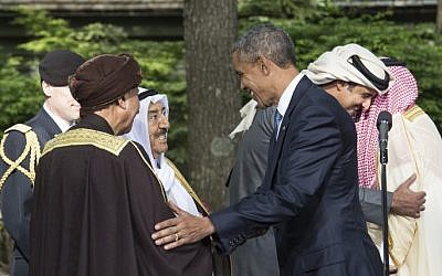 US President Barack Obama (center) says goodbye to the emir of Kuwait Sheikh Sabah al-Ahmad al-Jaber al-Sabah (2nd left) and Oman's Deputy Prime Minister Fahd bin Mahmud al-Said at the end of a summit meeting with leaders of the Gulf Cooperation Council (GCC) at Camp David in Maryland, on May 14, 2015. (Nicholas Kamm/AFP)
