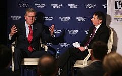 Jeb Bush, left, participates in a discussion with the Editor of the National Review, Rich Lowry during the National Review Institute 2015 Ideas Summit April 30, 2015 in Washington, DC. photo credit: Alex Wong/Getty Images/AFP)