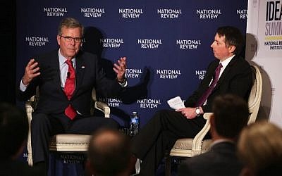 Jeb Bush, left, participates in a discussion with the Editor of the National Review, Rich Lowry during the National Review Institute 2015 Ideas Summit April 30, 2015 in Washington, DC. photo credit: Alex Wong/Getty Images/AFP)