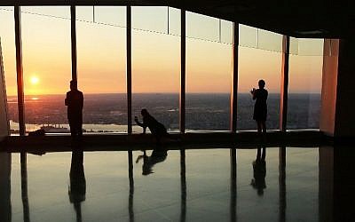 People view the sunrise at the newly built One World Observatory at One World Trade Center on the day it opens to the public on May 29, 2015 in New York City. (Spencer Platt/Getty Images/AFP)