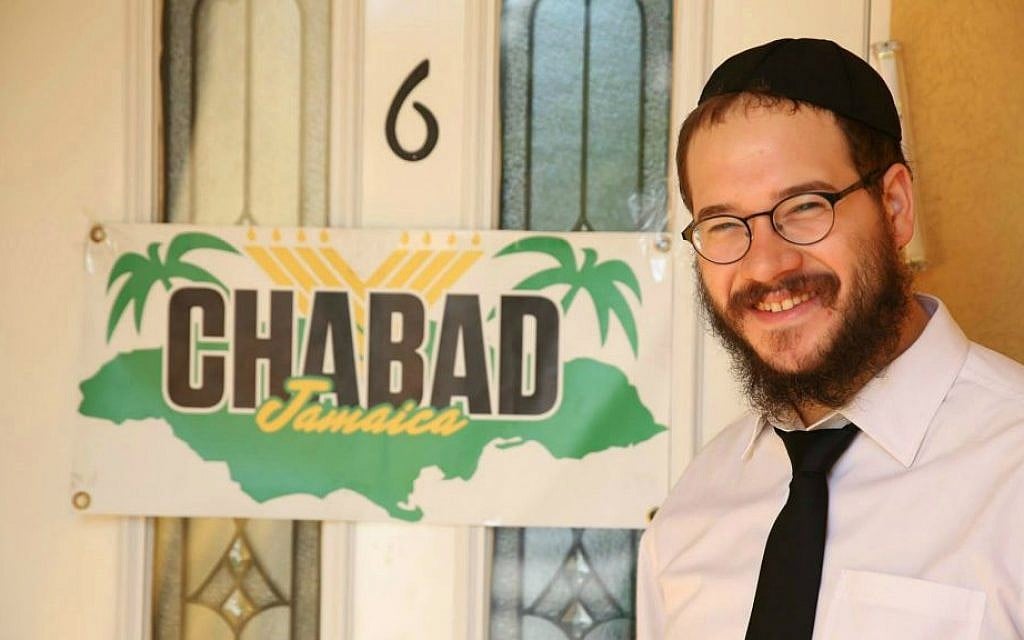 Rabbi Yaakov Raskin in front of the Chabad House in Montego Bay, Jamaica. (Courtesy) Rabbi Yaakov Raskin in front of the Chabad House in Montego Bay, Jamaica. (Courtesy)