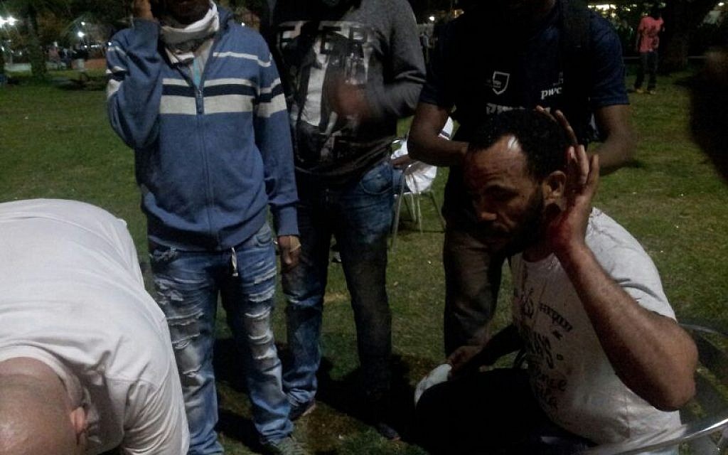 A wounded protester is treated by Magen David Adom. Tel Aviv. May 3, 2015 (photo credit: Judah Ari Gross/Times of Israel)