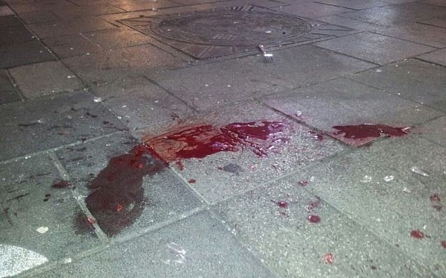 A pool of blood in Rabin Square. 'See, our blood is just like yours,' a protester says (photo credit: Judah Ari Gross/Times of Israel)