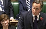 Nicky Morgan, the UK Secretary of State for Eduction, alongside Prime Minister David Cameron in the House of Commons, October 2014 (AP Photo/Parliamentary Recording Unit via AP)