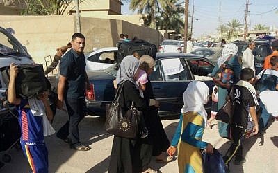 Civilians flee their hometown of Ramadi, the capital of Iraq's Anbar province, 115 kilometers (70 miles) west of Baghdad, Monday, May 18, 2015. Islamic State militants searched door-to-door for policemen and pro-government fighters and threw bodies in the Euphrates River in a bloody purge Monday after capturing the strategic city of Ramadi, their biggest victory since overrunning much of northern and western Iraq last year. (AP)