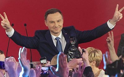 Opposition candidate Andrzej Duda celebrates his victory (AP Photo/Czarek Sokolowski)
