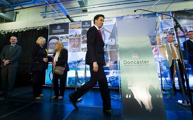 Labour Party leader Ed Miliband, center, walks from the stage after holding his seat as results are announced in Britain's general election, in Doncaster, England, Friday May 8, 2015. (AP Photo/Jon Super) Labour Party leader Ed Miliband, center, walks from the stage after holding his seat as results are announced in Britain's general election, in Doncaster, England, Friday May 8, 2015. (AP Photo/Jon Super)