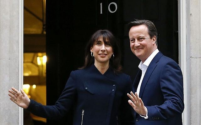 Britain's Prime Minister David Cameron and his wife Samantha return to 10 Downing Street in London, Friday, May 8, 2015, having won the previous day's elections. (photo credit: AP Photo/Kirsty Wigglesworth)