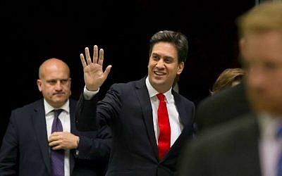 File: Labour Party leader Ed Miliband, center, arrives at Doncaster Racecourse as results come in after voting closes in Britain's general election, in Doncaster, England, Friday May 8, 2015. (AP Photo/Jon Super)
