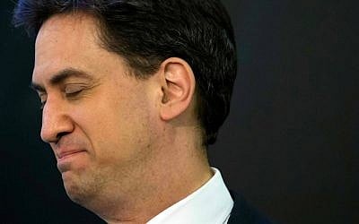 Labour Party leader Ed Miliband waits to speak after holding his seat as results are announced in Britain's general election, in Doncaster, England, Friday May 8, 2015. (AP Photo/Jon Super)