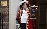 Tony Appleton, a town crier, announces the birth of the royal baby outside the Lindo Wing, St. Mary's Hospital, London, Saturday, May 2, 2015. Kate, the Duchess of Cambridge, has given birth to a baby girl, royal officials said Saturday. (photo credit: Daniel Leal-Olivas/PA via AP)