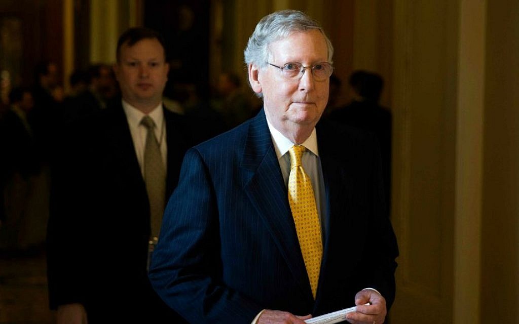 In this May 5, 2015, file photo, Senate Majority Leader Senator Mitch McConnell of Kentucky walks to his office on Capitol Hill in Washington, after a news conference. (Evan Vucci/AP)