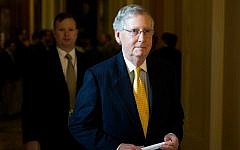 In this May 5, 2015, file photo, Senate Majority Leader Senator Mitch McConnell of Kentucky walks to his office on Capitol Hill in Washington, after a news conference. (Evan Vucci/AP)