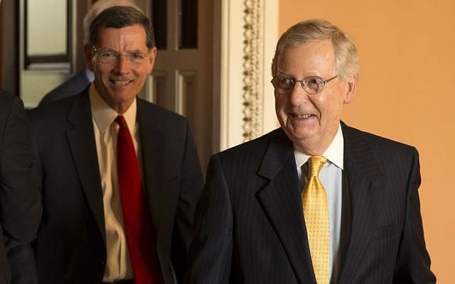 Senate Majority Leader Mitch McConnell of Ky., right, followed by Sen. John Barrasso, R-Wyo., leaves a GOP luncheon on Capitol Hill in Washington, Tuesday, May 5, 2015. (photo credit: AP/Brett Carlsen) Senate Majority Leader Mitch McConnell of Ky., right, followed by Sen. John Barrasso, R-Wyo., leaves a GOP luncheon on Capitol Hill in Washington, Tuesday, May 5, 2015. (photo credit: AP/Brett Carlsen)