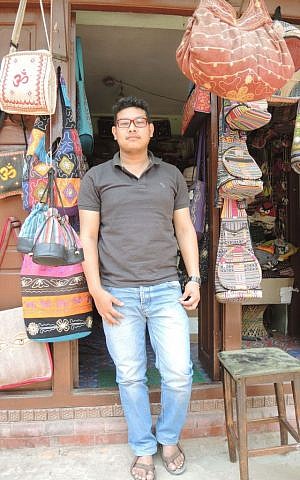 Sanjay Darshandhari, 20, the owner of a handicraft store in Bhaktapur, said he opened his store soon after the quake to help normalcy return to the neighborhood. (Melanie Lidman/Times of Israel)