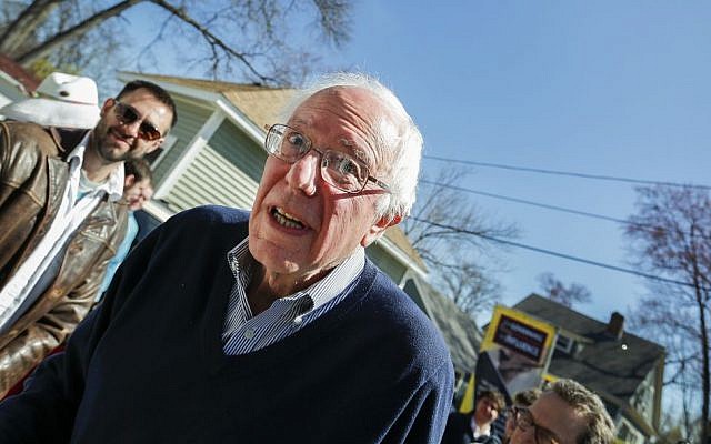 Presidential hopeful Senator Bernie Sanders makes his way in to a house party in Manchester, New Hampshire, Saturday, May 2, 2015. (AP/Cheryl Senter)