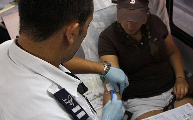 Illustrative. A young girl gives blood at a Magen David Adom mobile blood donation center. (Daniel Dreifuss/Flash90) Illustrative. A young girl gives blood at a Magen David Adom mobile blood donation center. (Daniel Dreifuss/Flash90)