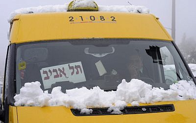 A shared sherut taxi on the way to Tel Aviv, January 10, 2013. (Photo credit: Louis Fisher/Flash90)