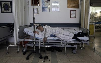 Illustrative photo of a patient kept in a corridor dur to overcrowding at a hospital. (photo credit: Tsafrir Abayov/Flash90)