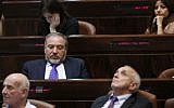 An illustrative photo of bored looking lawmakers in the Knesset on October 14, 2013. (Photo credit: Miriam Alster/FLASH90)