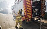 Firefighters trying to extinguish a large fire that broke in Jerusalem on August 26, 2014. (Photo credit: Yonatan Sindel/Flash90)