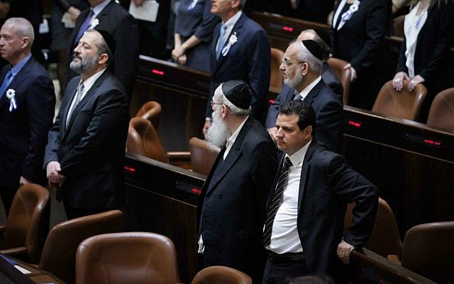 Arab Joint List leader Ayman Odeh (bottom R) seen during the swearing-in ceremony of the 20th Knesset, March 31, 2015. (Miriam Alster/Flash90) Arab Joint List leader Ayman Odeh (bottom R) seen during the swearing-in ceremony of the 20th Knesset, March 31, 2015. (Miriam Alster/Flash90)