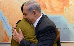 Prime Minister Benjamin Netanyahu meets with Damas Pakada, the Israeli Ethiopian soldier who was assaulted by police officers last week, at the Prime Minister's Office in Jerusalem, May 4, 2015. (photo credit: Haim Zach/GPO)