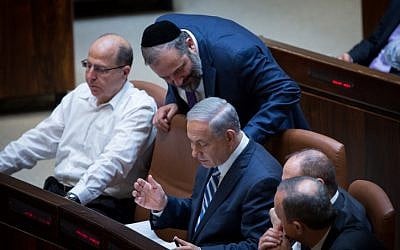 Prime Minister Benjamin Netanyahu speaks with leader of the Shas party, Aryeh Deri, during a plenum session in the Knesset on May 4, 2015. (photo credit: Miriam Alster/Flash90) Prime Minister Benjamin Netanyahu speaks with leader of the Shas party, Aryeh Deri, during a plenum session in the Knesset on May 4, 2015. (photo credit: Miriam Alster/Flash90)