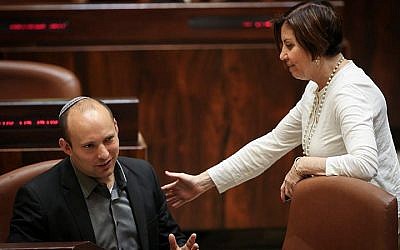 Meretz chairwoman Zehava Galon speaks with political rival and Jewish Home leader, Naftali Bennet in the Knesset on May 6, 2015. (Photo credit: Hadas Parush/Flash90)
