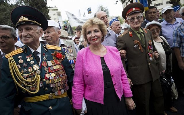 Immigration Minister Sofa Landver walks with Russian-Israeli World War II veterans as they take part in the Veterans Day parade in honor of 70 years since the Allies' victory over Nazi Germany in World War II, in the center of Jerusalem. May 10, 2015. (photo credit: Nati Shohat/Flash 90)