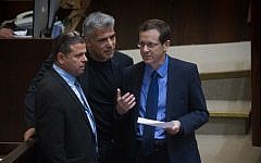 Zionist Union leader Isaac Herzog speaks with Yesh Atid party leader Yair Lapid and Zionist Union MK Eitan Cabel during a plenum session on expanding the number of ministers in the new cabinet, on May 11, 2015. (Photo credit: Miriam Alster/Flash90)