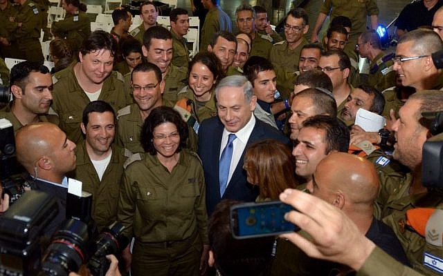 Prime Minister Benjamin Netanyahu (C) seen during a welcome ceremony for the IDF aid delegation that arrived back from Nepal at Ben Gurion Airport, May 12, 2015. (photo credit: Haim Zach/GPO) Prime Minister Benjamin Netanyahu (C) seen during a welcome ceremony for the IDF aid delegation that arrived back from Nepal at Ben Gurion Airport, May 12, 2015. (photo credit: Haim Zach/GPO)