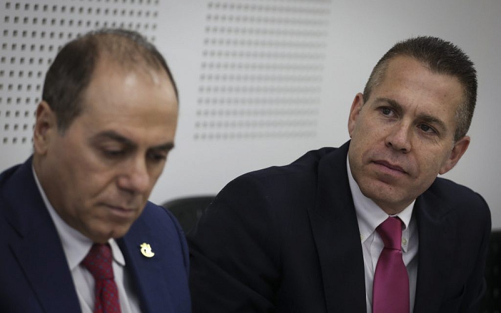Newly appointed Interior Minister Silvan Shalom (L) and outgoing minister Gilad Erdan (R) at the Interior Ministry in Jerusalem on May 17, 2015. (Hadas Parush/Flash90)