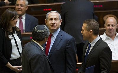 Newly appointed Minister of Internal Security, Gilad Erdan (R) speaks with Prime Minister Benjamin Netanyahu (C) and Minister of Immigrant Absorption Ze'ev Elkin at the Knesset assembly hall, May 25, 2015. (Yonatan Sindel/Flash90)