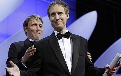 Director Laszlo Nemes, right, is presented the Grand Prix award by actor Mads Mikkelsen for the film Son of Saul during the awards ceremony at the 68th international film festival, Cannes, southern France, Sunday, May 24, 2015. (AP Photo/Lionel Cironneau) Director Laszlo Nemes, right, is presented the Grand Prix award by actor Mads Mikkelsen for the film Son of Saul during the awards ceremony at the 68th international film festival, Cannes, southern France, Sunday, May 24, 2015. (AP Photo/Lionel Cironneau)