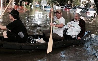 Houston Rabbi Joseph Radinsky is paddled to safety, May 27, 2015 (Facebook)