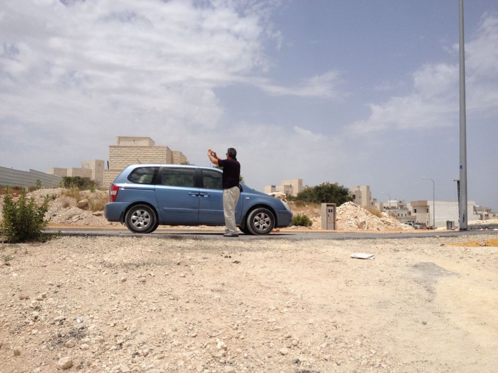 Malka and his mini-van; a man on a mission (Photo credit: Jessica Steinberg/Times of Israel) Malka and his mini-van; a man on a mission (Photo credit: Jessica Steinberg/Times of Israel)