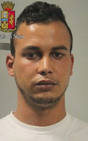 This photo released by Italian Police on Wednesday May 20, 2015, shows Touil Abdelmajid, who was arrested Tuesday evening May 19 at the home of his mother in Gaggiano, near Milan. (Italian Police via AP)