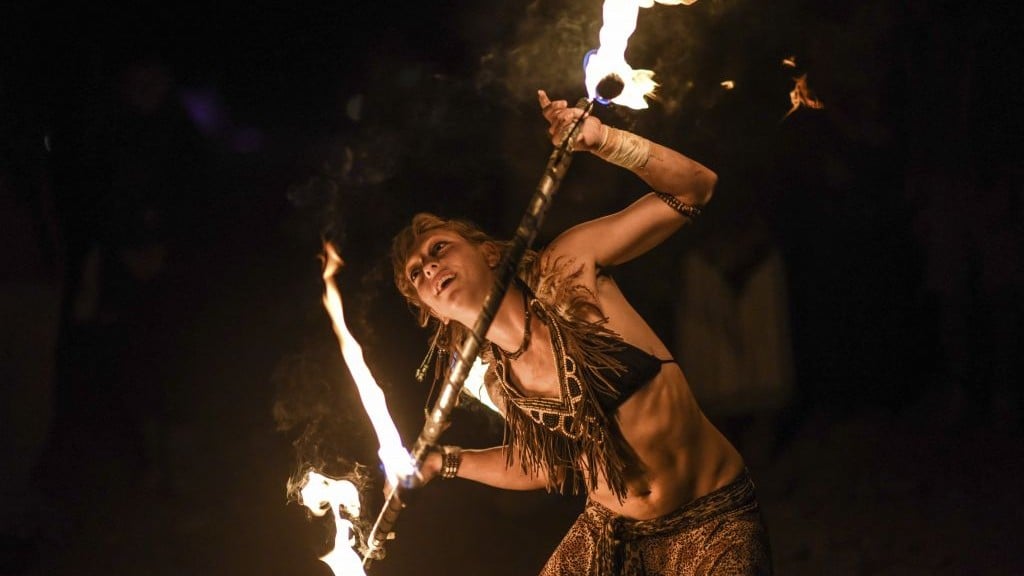A Midburn participant a twirls flaming baton at the second annual festival modeled after America's Burning Man on May 24, 2015. (Photo credit: Ben Kelmer/Flash90) A Midburn participant a twirls flaming baton at the second annual festival modeled after America's Burning Man on May 24, 2015. (Photo credit: Ben Kelmer/Flash90)