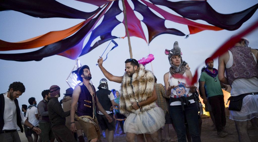 Costumed party-goers dancing during the second annual Midburn festival, the Israeli version of Burning Man on May 24, 2015. (Photo credit: Ben Kelmer/Flash90) Costumed party-goers dancing during the second annual Midburn festival, the Israeli version of Burning Man on May 24, 2015. (Photo credit: Ben Kelmer/Flash90)