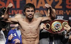 Manny Pacquiao poses during his weigh-in on Friday, May 1, 2015 in Las Vegas. (photo credit: AP/Chris Carlson)
