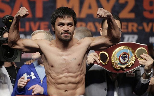 Manny Pacquiao poses during his weigh-in on Friday, May 1, 2015 in Las Vegas. (photo credit: AP/Chris Carlson) Manny Pacquiao poses during his weigh-in on Friday, May 1, 2015 in Las Vegas. (photo credit: AP/Chris Carlson)